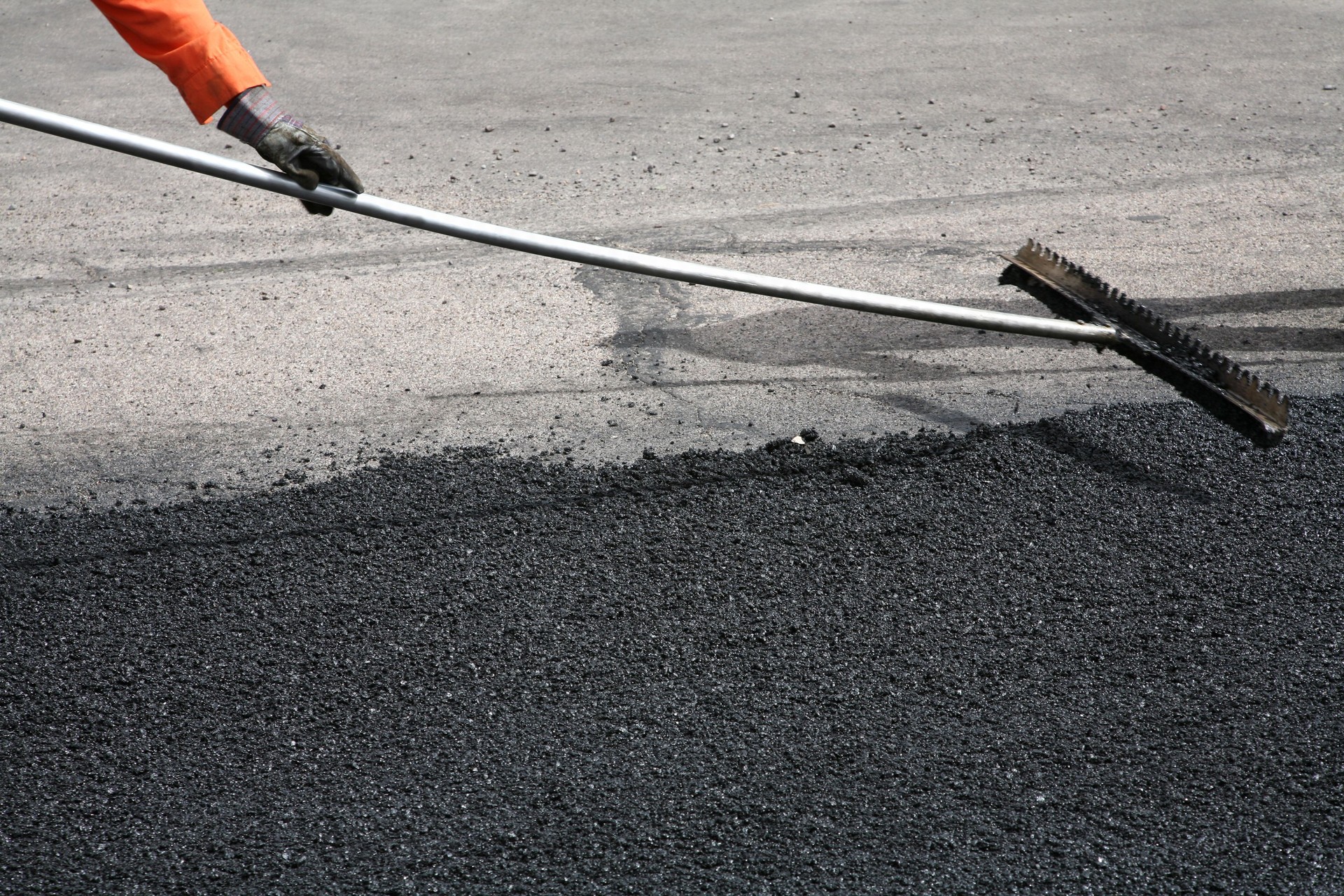 Road Repair With Hot Tar Mixture.